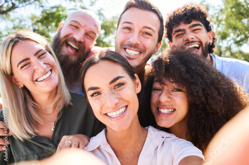Multiracial people taking selfie outdoors - Happy life style concept with young smiling friends having fun together.