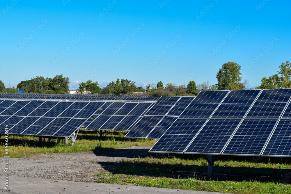 Solar Power Panels in a Solar Farm for Clean Green Alternative Energy Production to Battle Climate Change Global Warming Solar Power Panels in a Solar Farm for Clean Green Alternative Energy Production to Battle Climate Change Global Warming