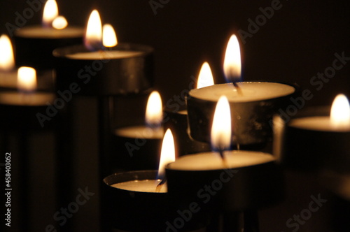 Candles Burning In Dark Background