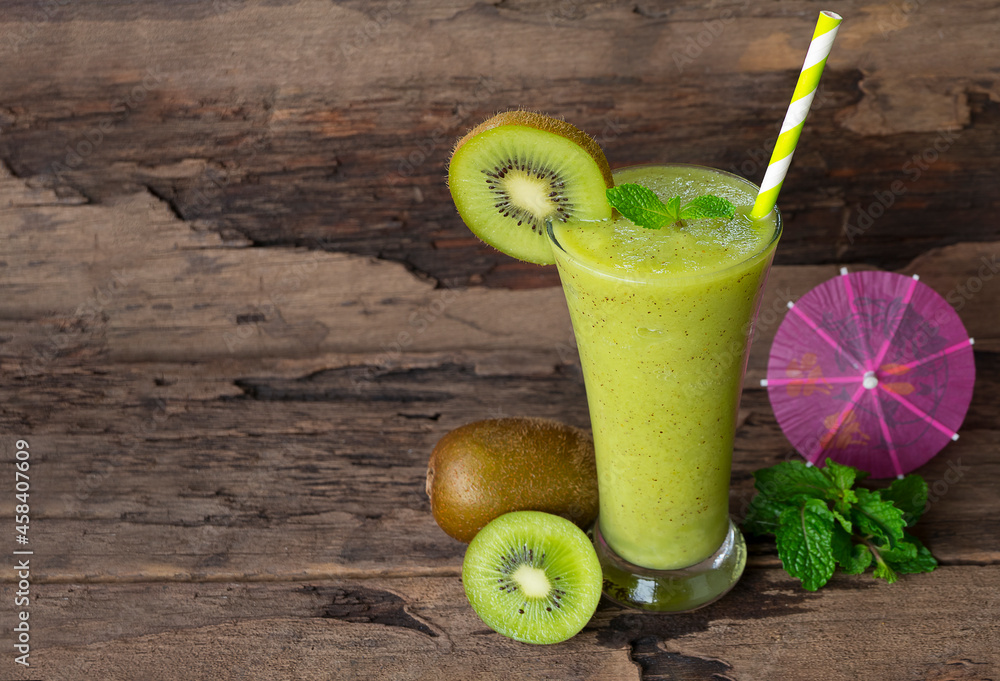 Kiwi yogurt fruit juice smoothie green colorful fruit juice milkshake blend beverage healthy high protein the taste yummy In glass drink episode morning on wood background.