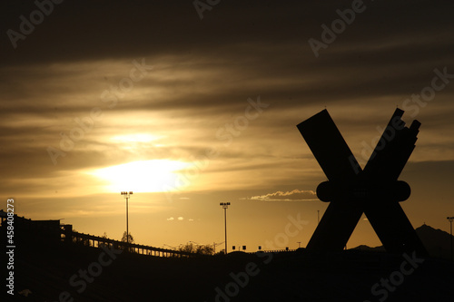 Картината върху платно Landscape Public sculpture of the X at sunset in Ciudad Juarez Chihuahua Border