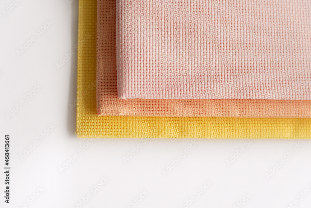 Fototapeta premium Canvas for needlework aida 14 yellow, pink, peach. Cross Stitch