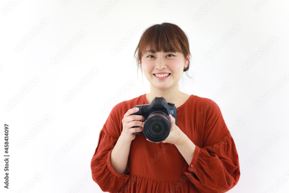 Fototapeta premium 一眼レフカメラを持つ女性