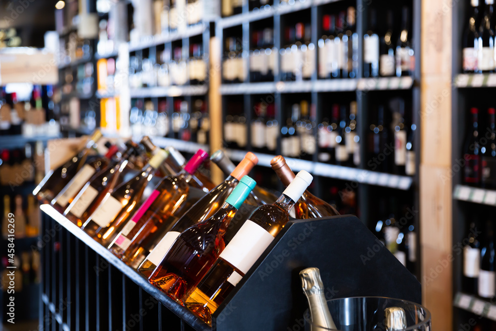 Quality wine bottles in wine store waiting for customers