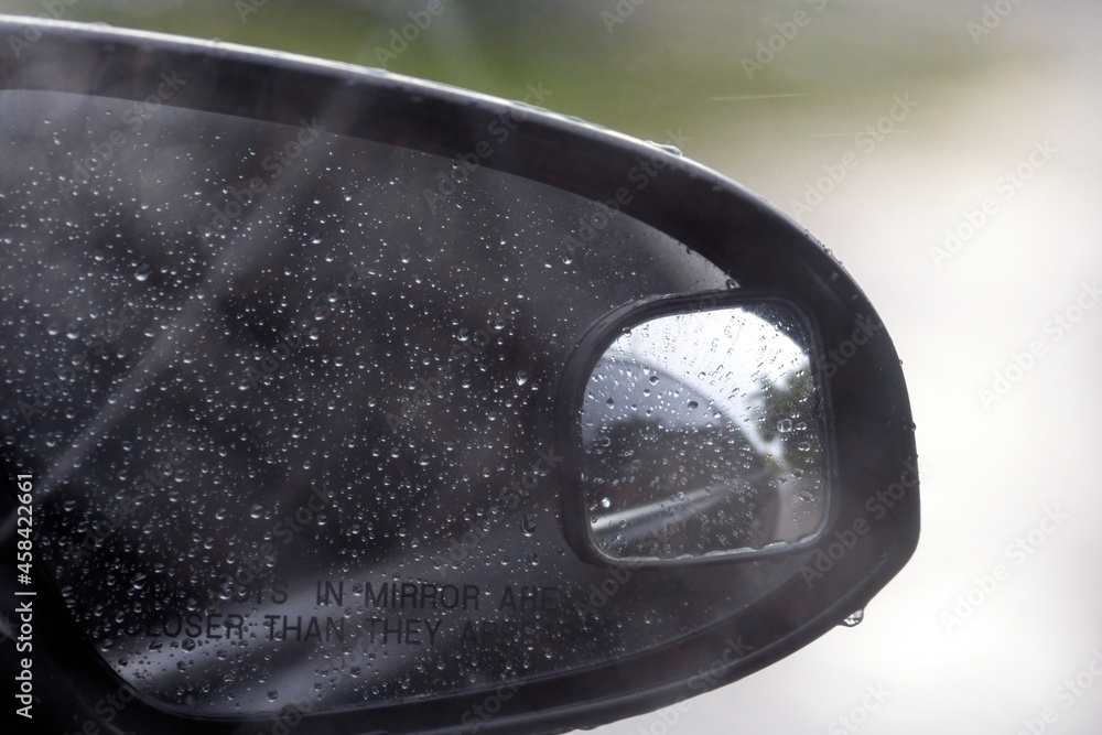 Shot from inside of a vehicle looking through the windshield while passing through traffic during a storm Shot from inside of a vehicle looking through the windshield while passing through traffic during a storm
