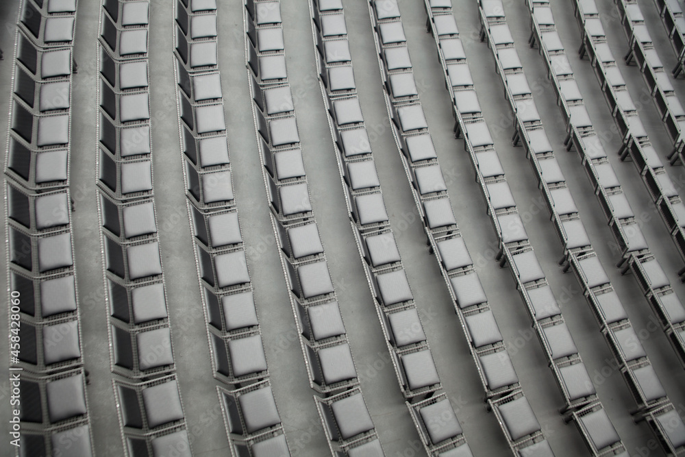 Empty rows of wire seats and theater or stadium cushion. Empty rows of wire seats and theater or stadium cushion.