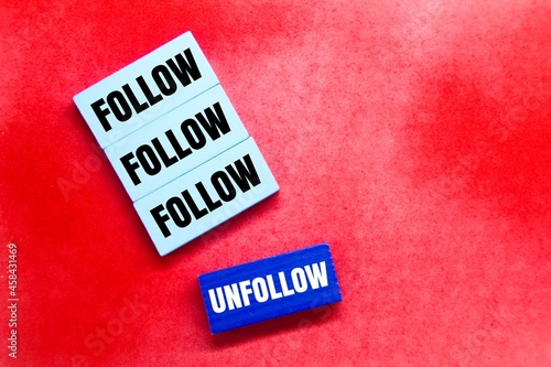 colored boards with the words Follow and unfollow photo