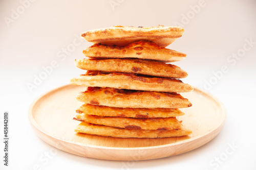 Wallpaper Mural stack of pizza on wood plate and white background Torontodigital.ca