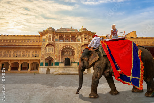 Woman tourist on elephant ride at the historic Amer Fort at Jaipur, Rajasthan, India