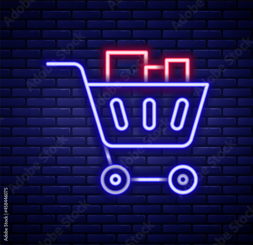 Glowing neon line Shopping cart and food icon isolated on brick wall background. Food store, supermarket. Colorful outline concept. Vector