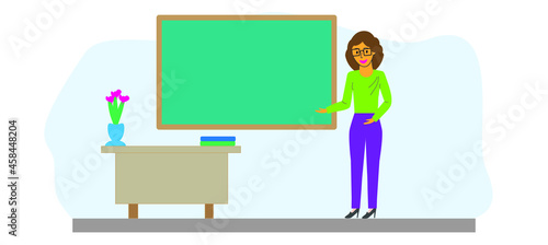A young teacher in the classroom near the blackboard in the classroom. The teacher points to the blackboard. Flat design style. Happy Teacher's Day. Poster, postcard, banner.