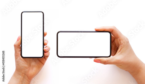 Mobile phone with empty white screen in hand in horizontal and vertical orientation, isolated on white background