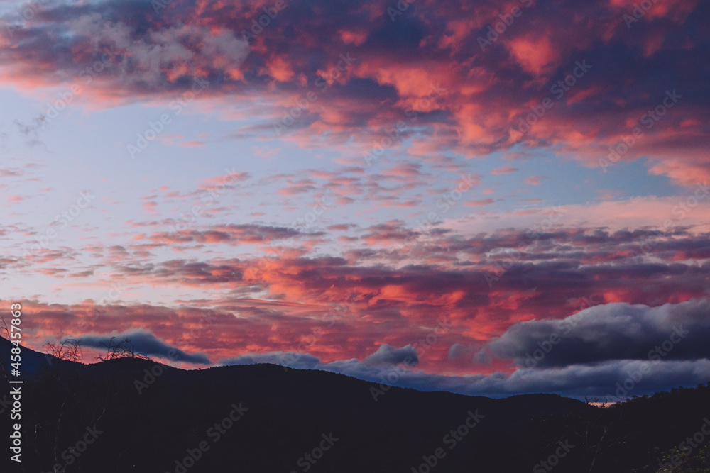 majestic pink sunset over the mountains shot in Tasmania, Australia majestic pink sunset over the mountains shot in Tasmania, Australia