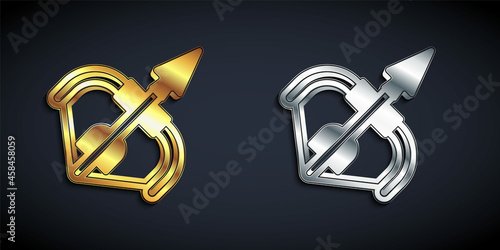 Gold and silver Medieval bow and arrow icon isolated on black background. Medieval weapon. Long shadow style. Vector