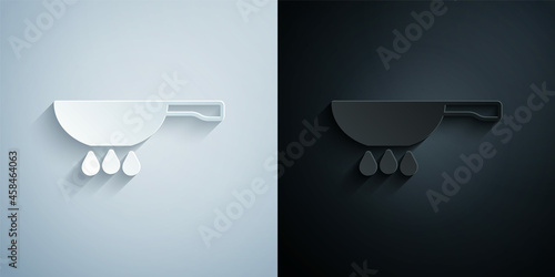 Paper cut Frying pan on fire icon isolated on grey and black background. Fry or roast food symbol. Paper art style. Vector
