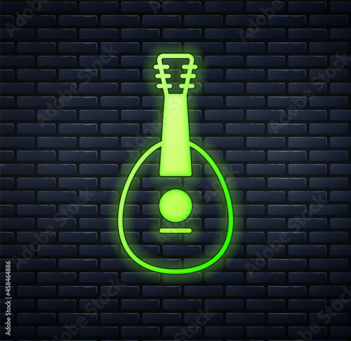 Glowing neon Traditional musical instrument mandolin icon isolated on brick wall background. Vector