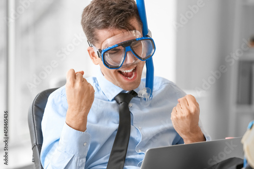 Happy man with snorkeling m...