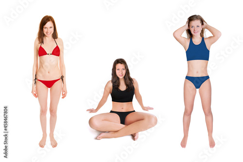 Three cheerful young woman wearing different swimwear, studio photo isolated in front of white background