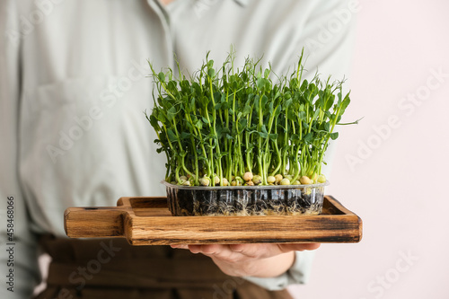 Woman with fresh micro gree...