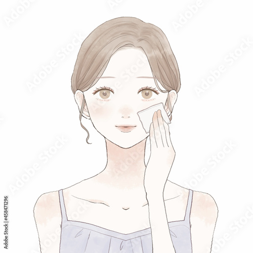 あぶらとり紙で顔の皮脂を取る女性