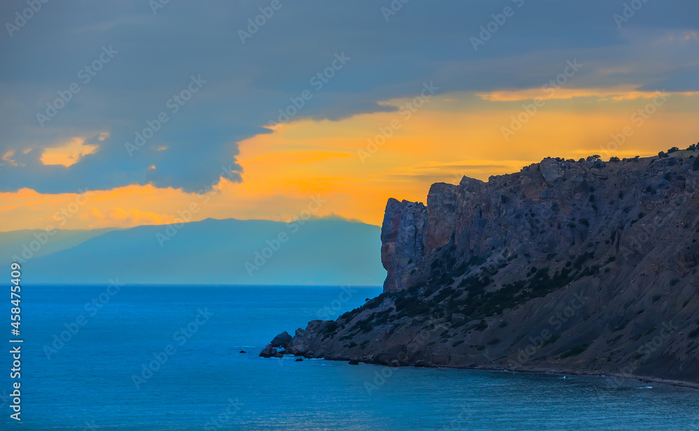 sunset on the rocky sea coast