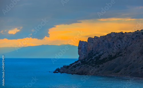 sunset on the rocky sea coast