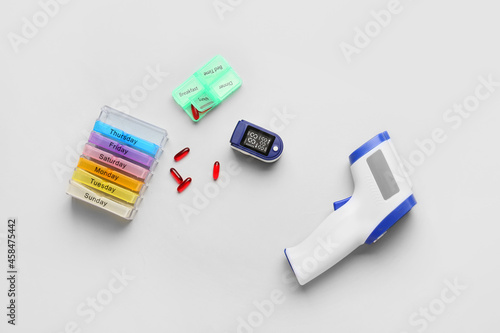 Composition with pulse oximeter and electronic thermodetector on light background