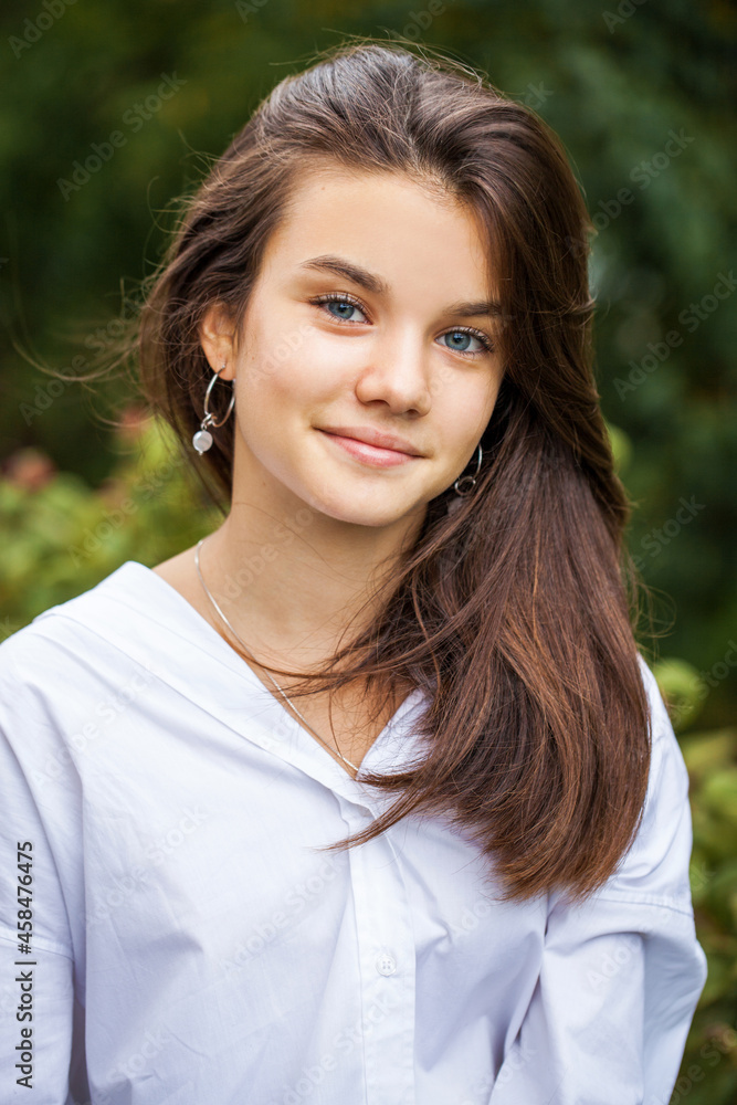 Young teenage brunette girl in white shirt Young teenage brunette girl in white shirt