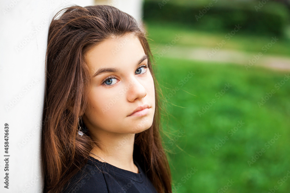 Young beautiful brunette girl, autumn park outdoors Young beautiful brunette girl, autumn park outdoors