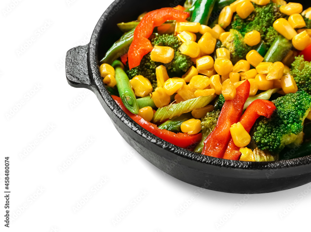 Frying pan with different vegetables on white background, closeup