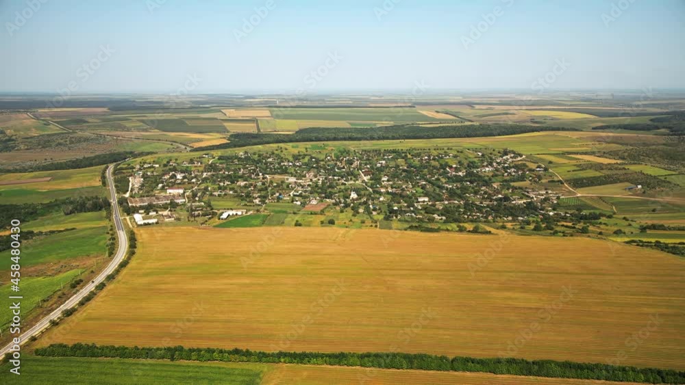 Aerial drone view of a village in Moldova. Wide fields around it Aerial drone view of a village in Moldova. Wide fields around it
