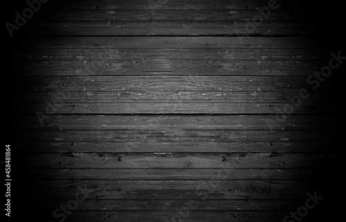 Old horizontal wooden shabby dark gray background or texture  part of rustic fence or walls of house