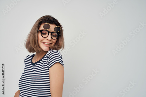 woman in striped t-shirt fashion glasses studio posing © SHOTPRIME STUDIO