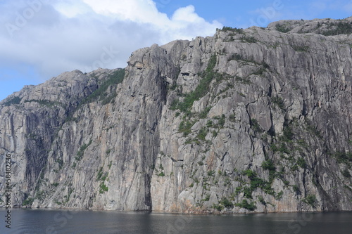 White and grey extremely steep granite rock walls of Lysefjord fjord and canyon in Norway in Scandinavia