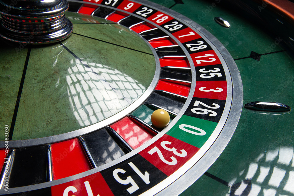 Casino Roulette Wheel. Ball in number zero. Close-up. Casino Roulette Wheel. Ball in number zero. Close-up.