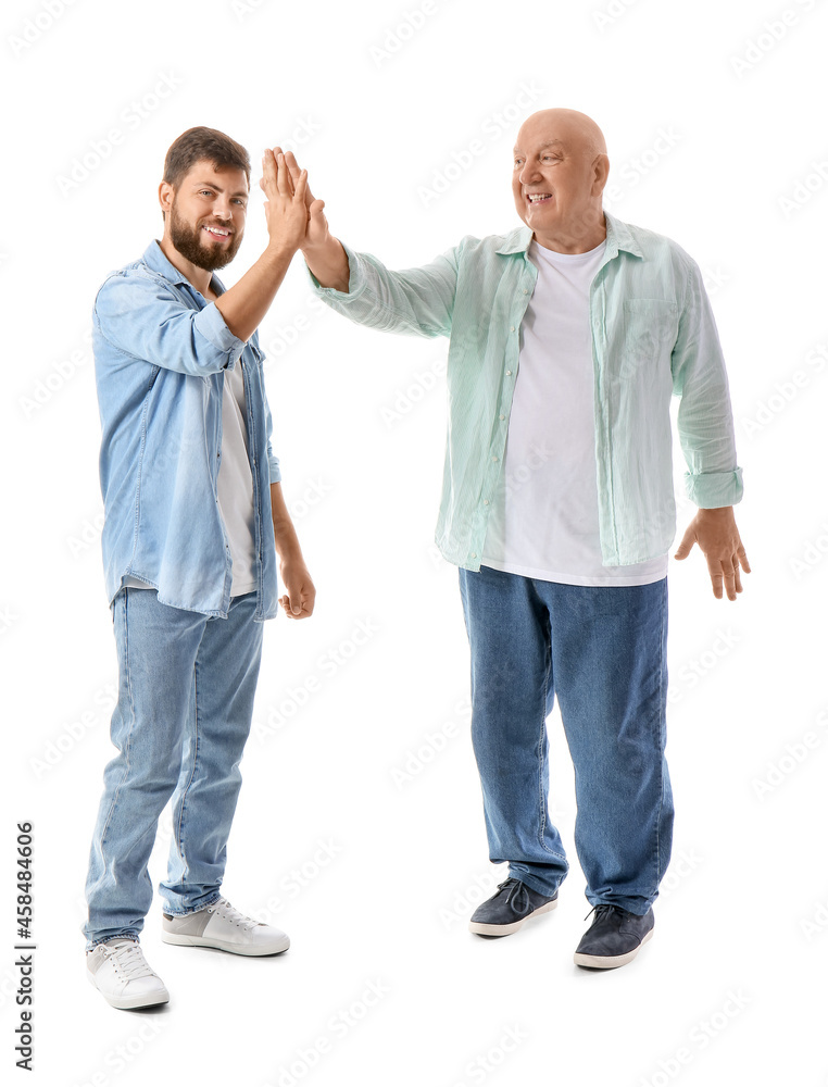 Happy man and his father giving each other high-five on white background Happy man and his father giving each other high-five on white background
