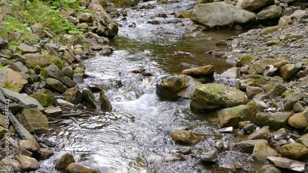 Beautiful mountain river. Landscape and stream of clear water. Mountain stream between the rocks. Beautiful mountain river. Landscape and stream of clear water. Mountain stream between the rocks.