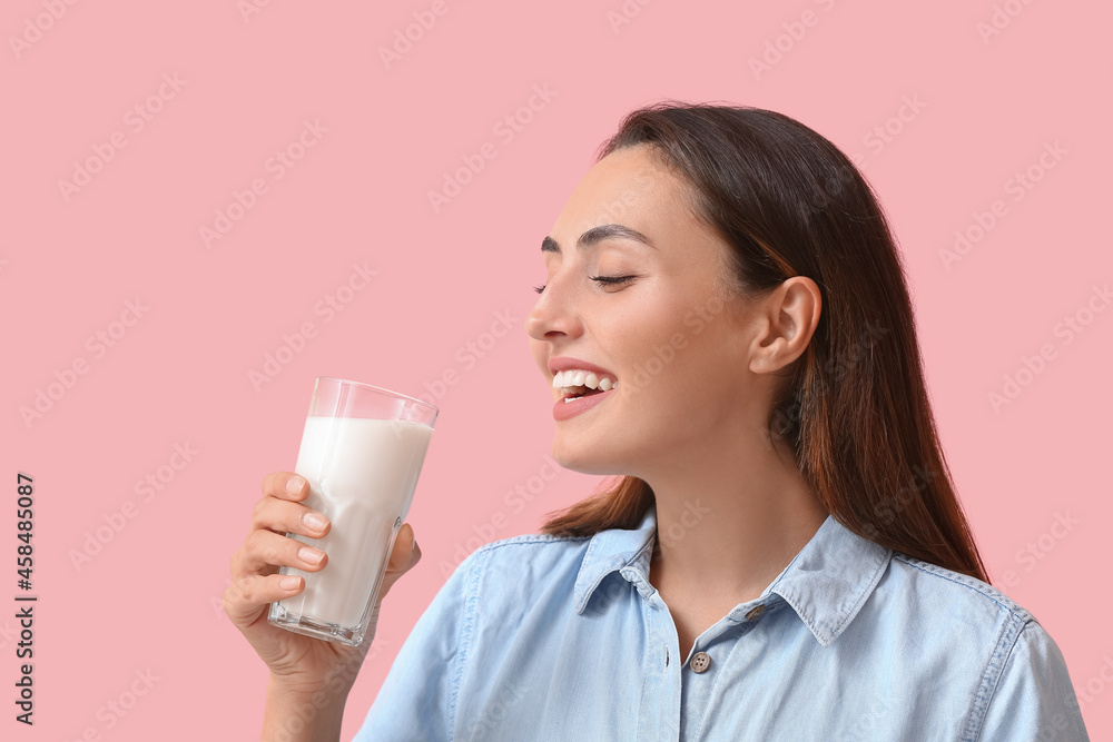 Young woman with glass of fresh milk on color background Young woman with glass of fresh milk on color background