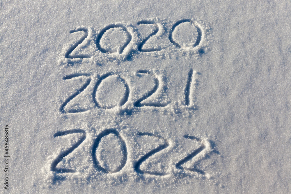 the inscription about the new year 2022 on the snow in winter the inscription about the new year 2022 on the snow in winter