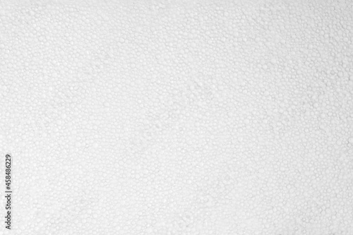 Abstract background from a piece of foam. Background: expanded polystyrene sheet