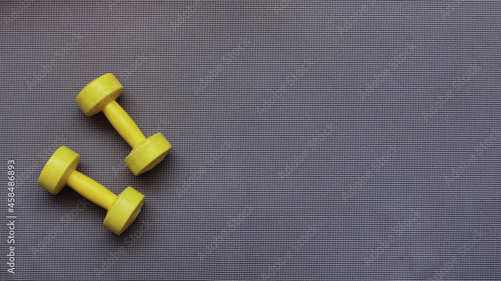 close up of dumbbell on black background close up of dumbbell on black background