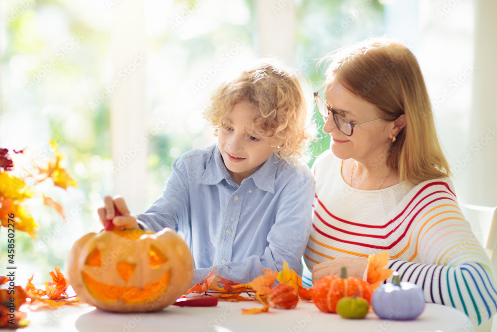 Family carving pumpkin for Halloween