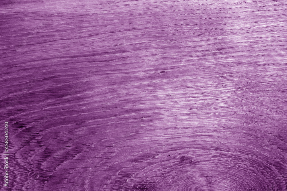 Old oak board texture as background with blur effect in purple tone. Old oak board texture as background with blur effect in purple tone.