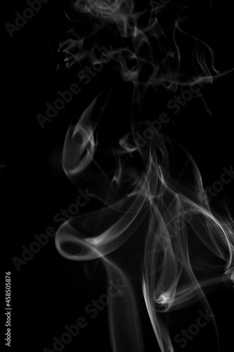 White smoke on black background.