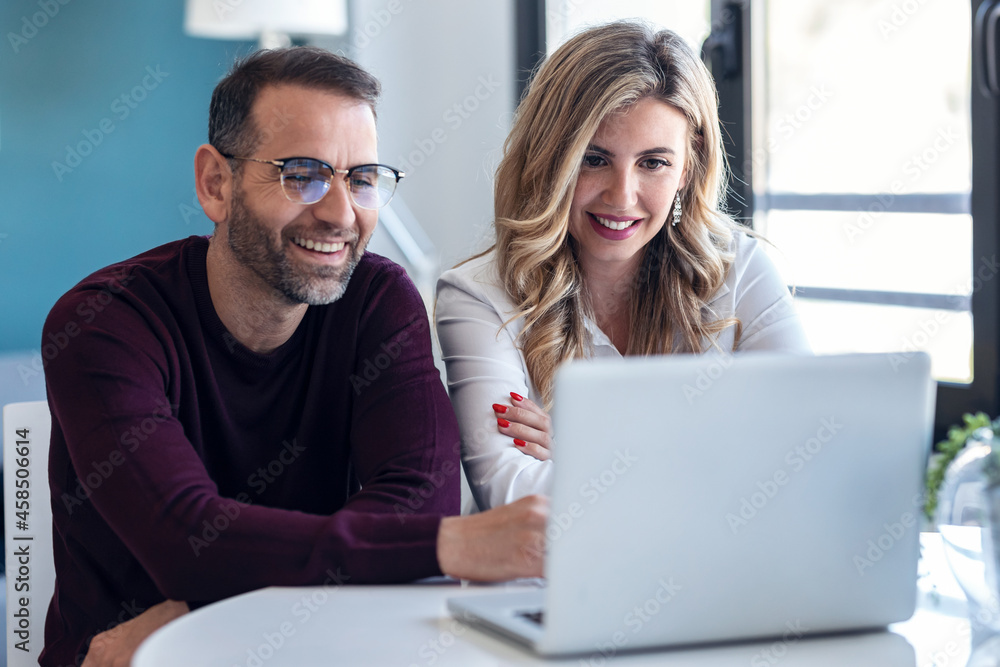 Businessperson explaing something looking at camera while doing video call in modern startup. Businessperson explaing something looking at camera while doing video call in modern startup.