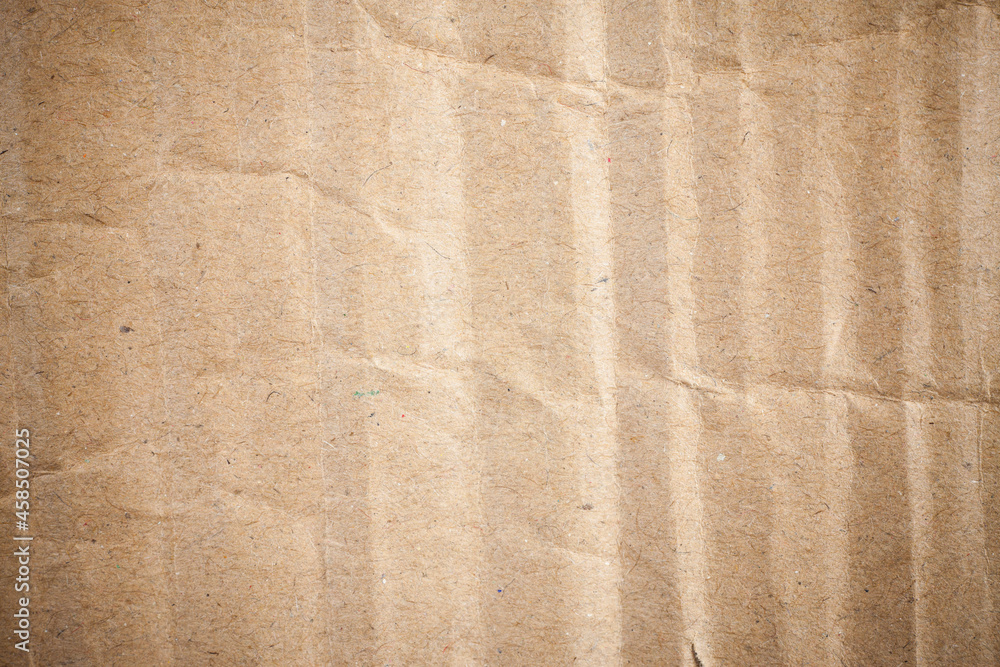 Cardboard brown paper background vignette. Cardboard brown paper background vignette.