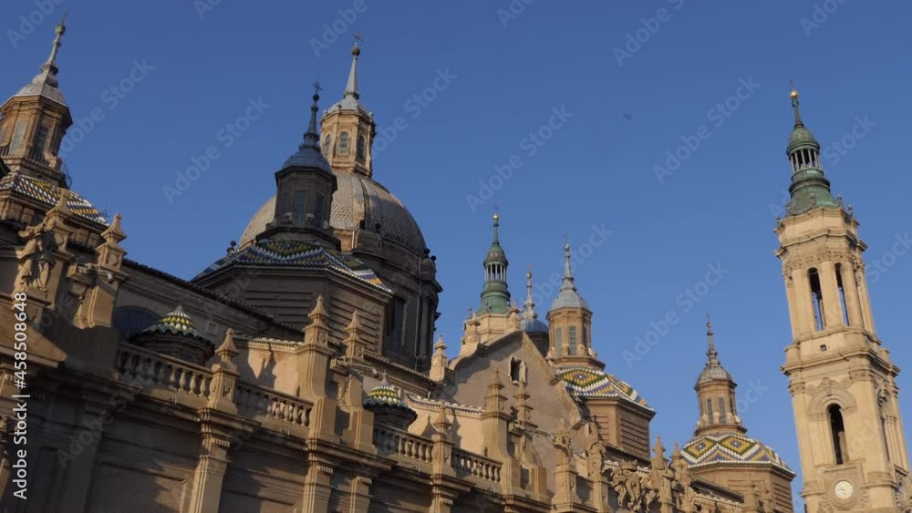 Urban view of Zaragoza, Spain with the Cathedral Basilica of Our Lady of the Pillar, a Roman Catholic church. Spanish city as travel destination, with monument and landmark at sunset on Ebro river Urban view of Zaragoza, Spain with the Cathedral Basilica of Our Lady of the Pillar, a Roman Catholic church. Spanish city as travel destination, with monument and landmark at sunset on Ebro river