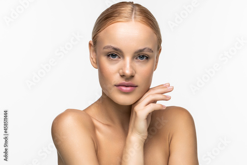 Beauty Woman face Portrait. Beautiful woman with Perfect fresh clean Skin color lips purple red. Blonde brunette short hair Youth and Skin Care Concept isolated on beige background