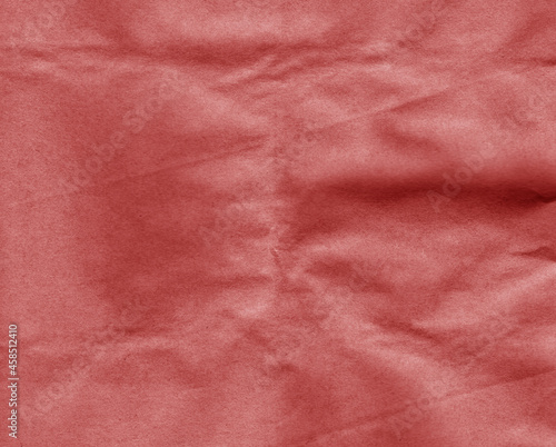 Crafted crumpled paper for background and desing in red tone.