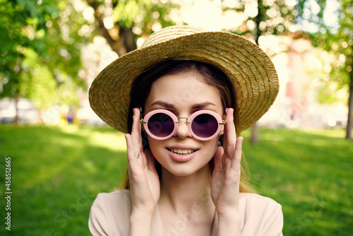 woman sunglasses and a hat in the park green grass model © SHOTPRIME STUDIO